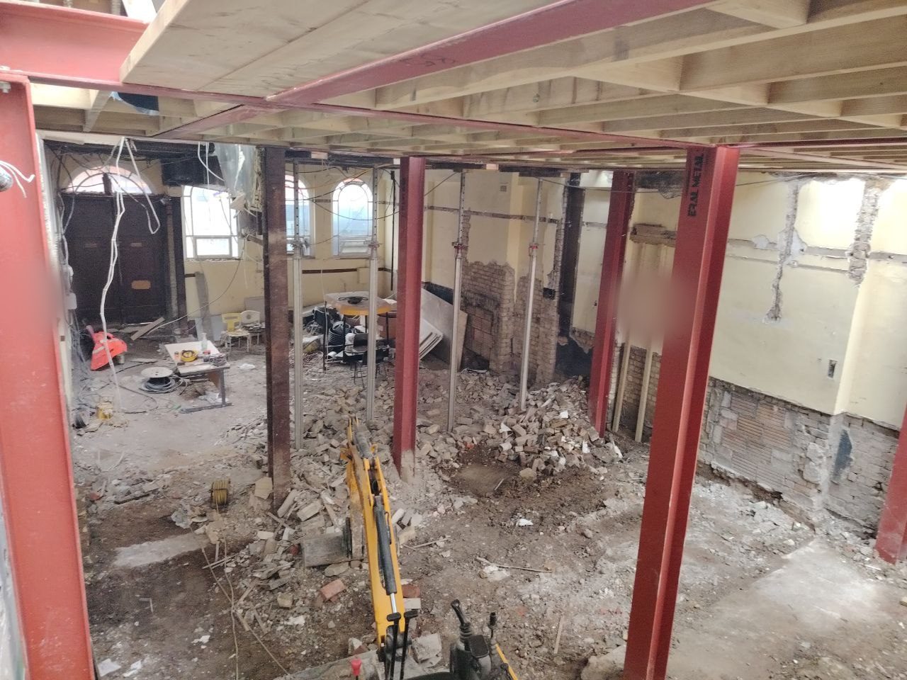 Excavation underway in the courtyard with scaffolding